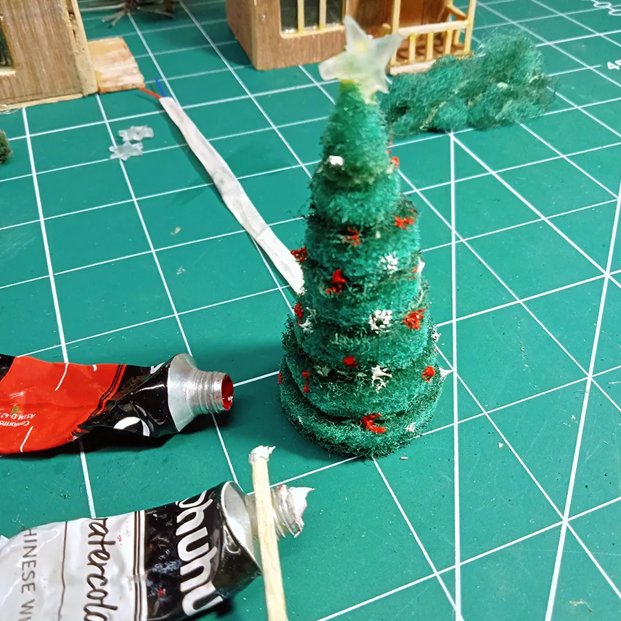 Colouring christmas tree  to create snowy miniature Cristmas theme