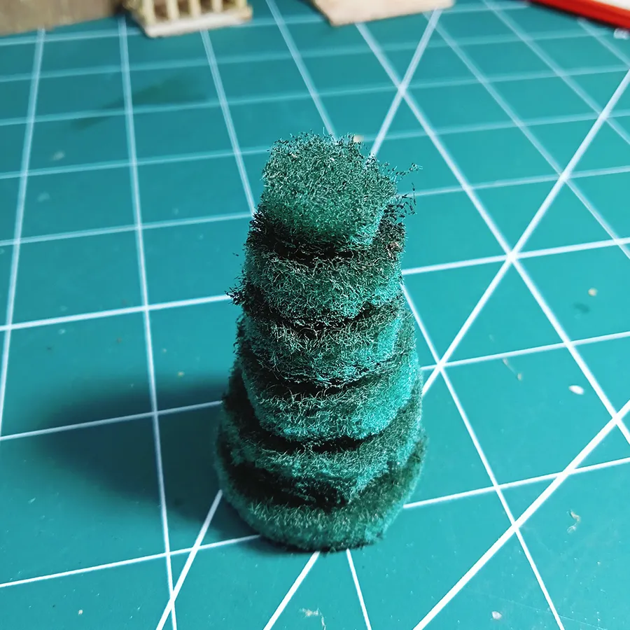 First-cut miniature Christmas tree -  creating snowy miniature Cristmas theme