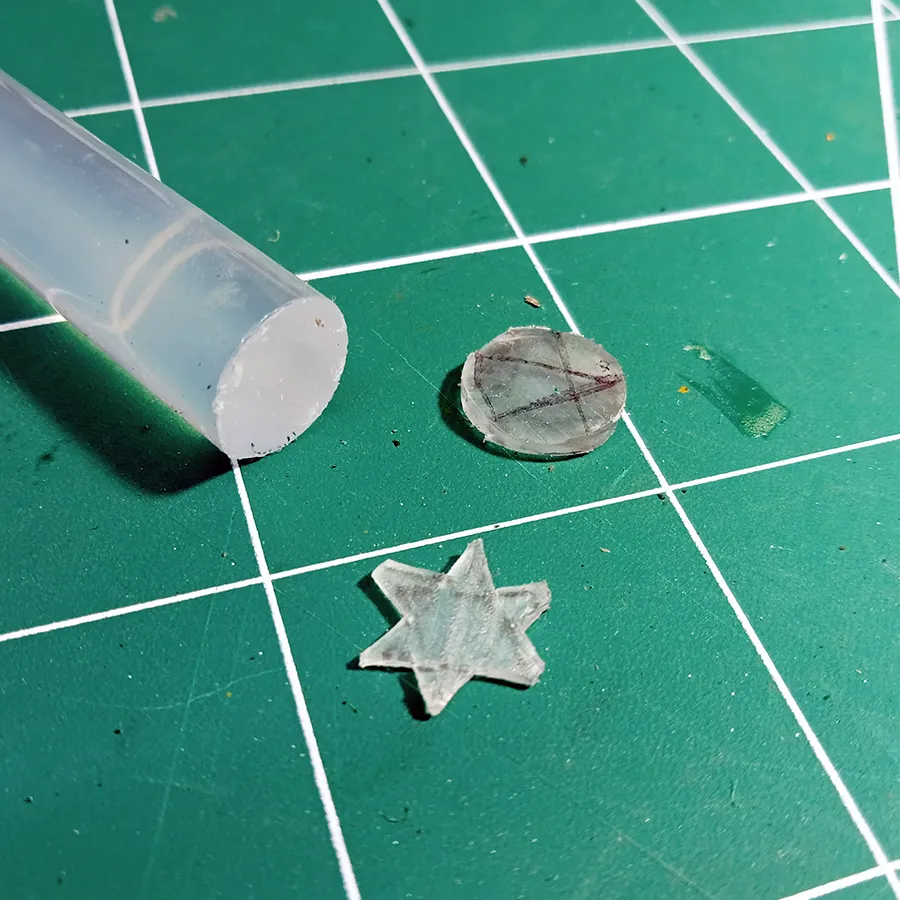 Star created from a hot glue stick   to create snowy miniature Cristmas theme