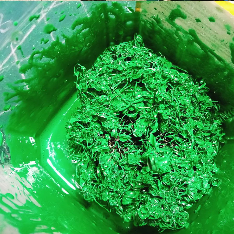 Steel scrubber mixed with acrylic paint to create a green texture  to create snowy miniature Cristmas theme